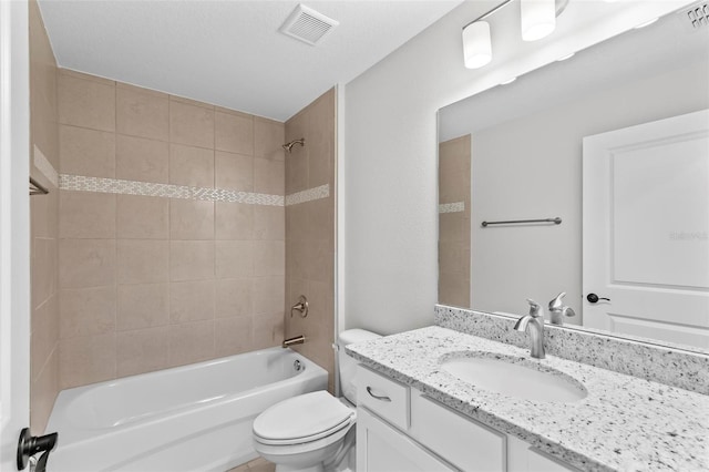 66 Ryland Dr, Palm Coast, FL 32164 - full bathroom featuring vanity, toilet, and tiled shower / bath