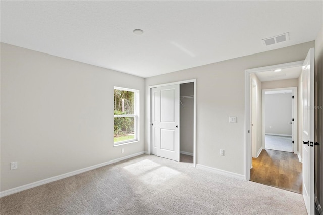 66 Ryland Dr, Palm Coast, FL 32164 - unfurnished bedroom with carpet floors and a closet