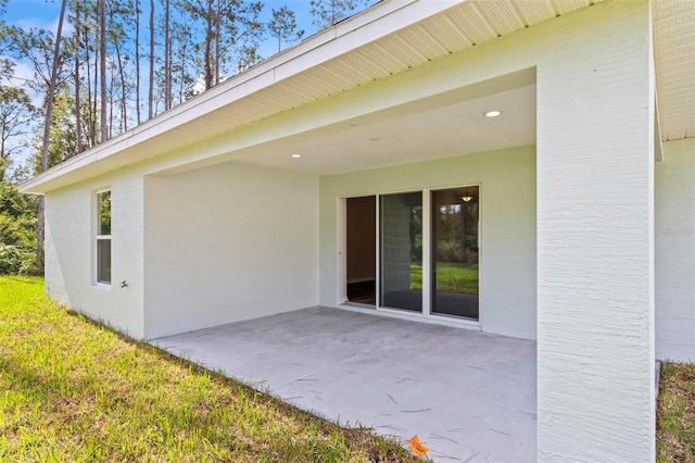 66 Ryland Dr, Palm Coast, FL 32164 - doorway to property featuring a patio area