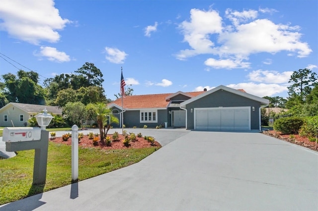 ranch-style house with a garage and a front lawn