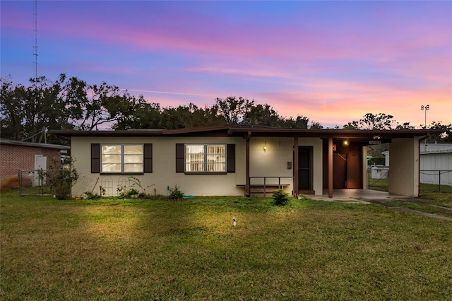 ranch-style house with a yard