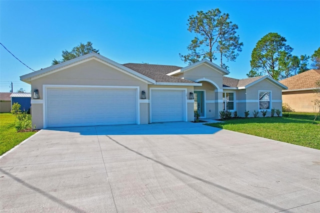 single story home featuring a garage and a front lawn