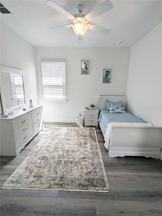 bedroom featuring ceiling fan and dark hardwood / wood-style floors