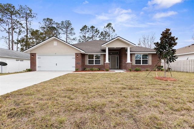 view of front of property featuring a garage and a front yard