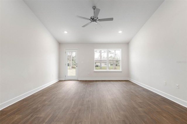 spare room with ceiling fan and dark wood-type flooring