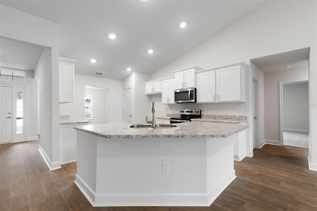 kitchen featuring white cabinetry, appliances with stainless steel finishes, dark hardwood / wood-style floors, light stone counters, and sink