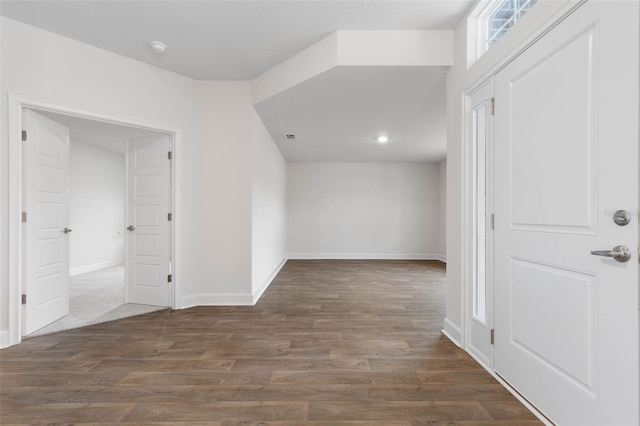 hall with dark hardwood / wood-style floors