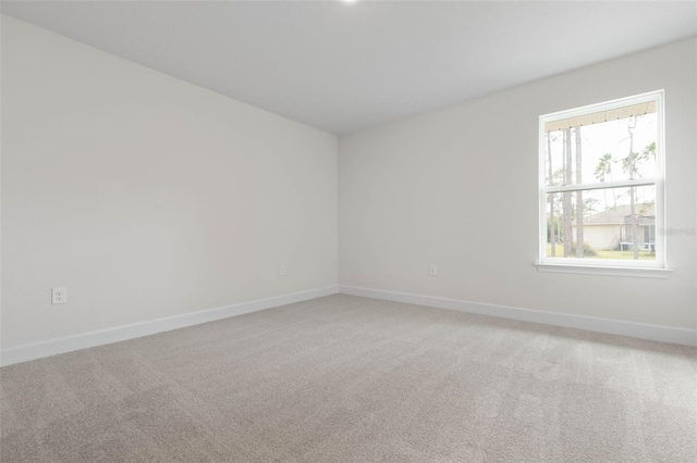 unfurnished room featuring carpet