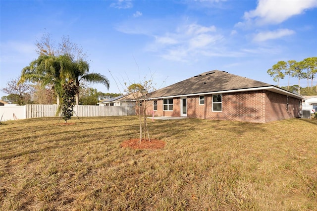 back of house with a yard