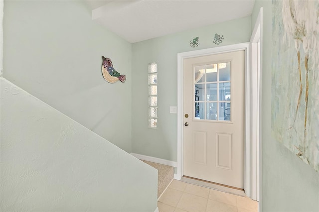 doorway with light tile patterned floors