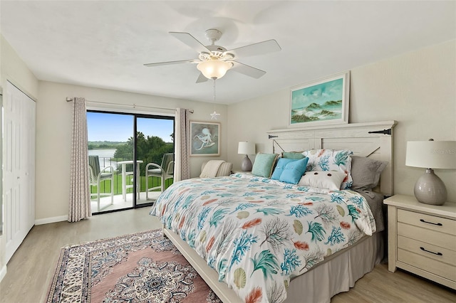 bedroom with light hardwood / wood-style floors, access to outside, ceiling fan, and a closet