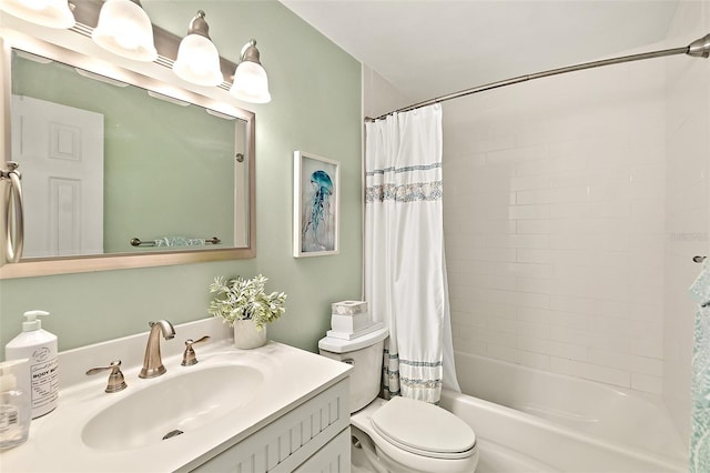 full bathroom featuring shower / bath combo, vanity, and toilet