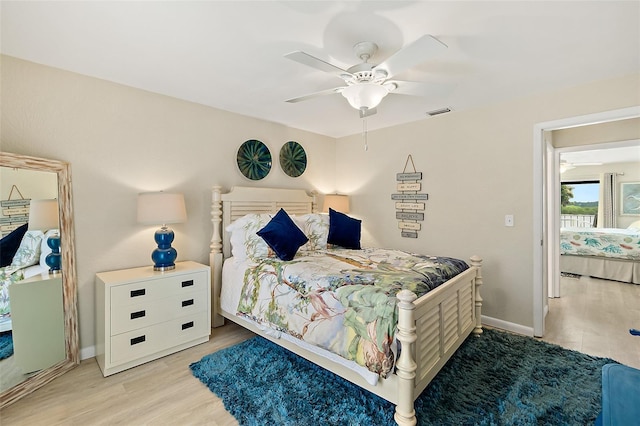 bedroom featuring ceiling fan and light wood-type flooring