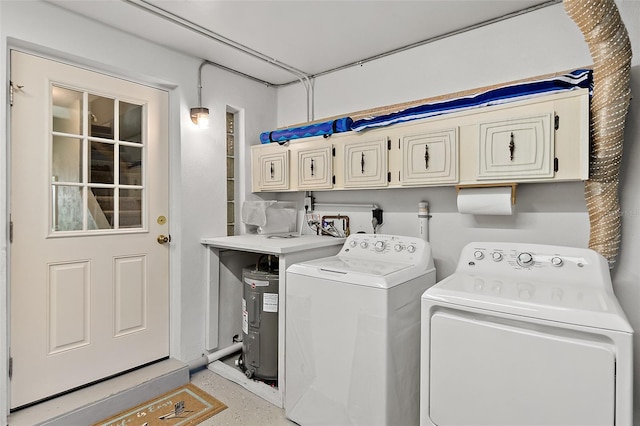 washroom featuring washer and dryer and cabinets