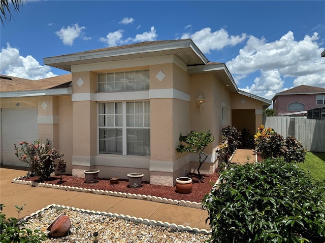 view of side of property with a garage