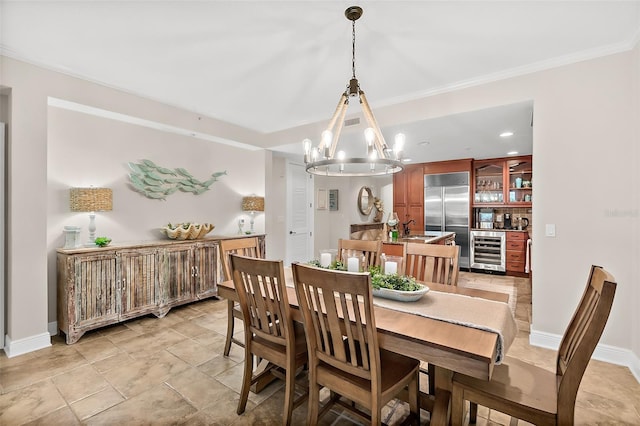 dining area with an inviting chandelier, beverage cooler, and sink