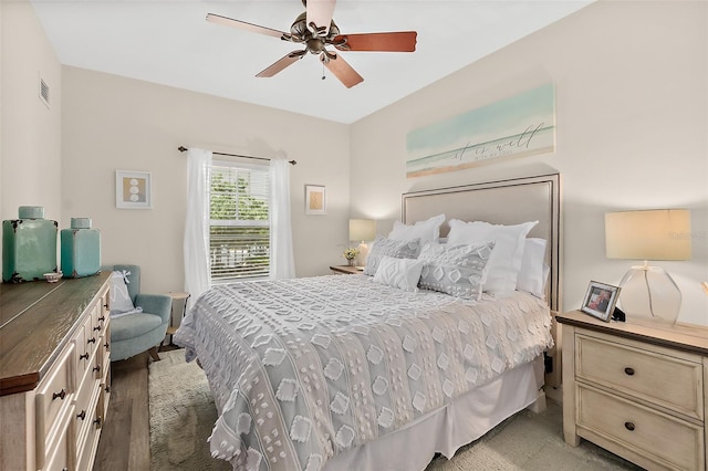 bedroom featuring ceiling fan and light hardwood / wood-style flooring