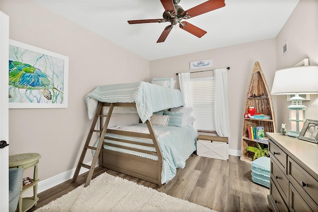 bedroom with ceiling fan and light hardwood / wood-style flooring