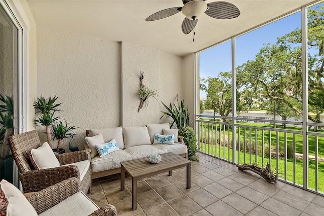 sunroom featuring ceiling fan