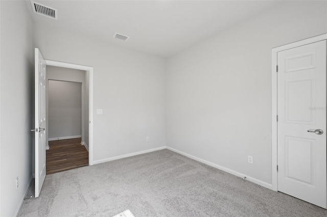 unfurnished bedroom featuring light colored carpet