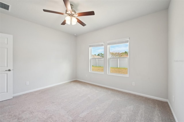 carpeted empty room with ceiling fan