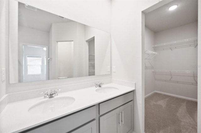 bathroom featuring toilet and vanity