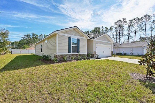 view of front of home featuring a front yard and a garage