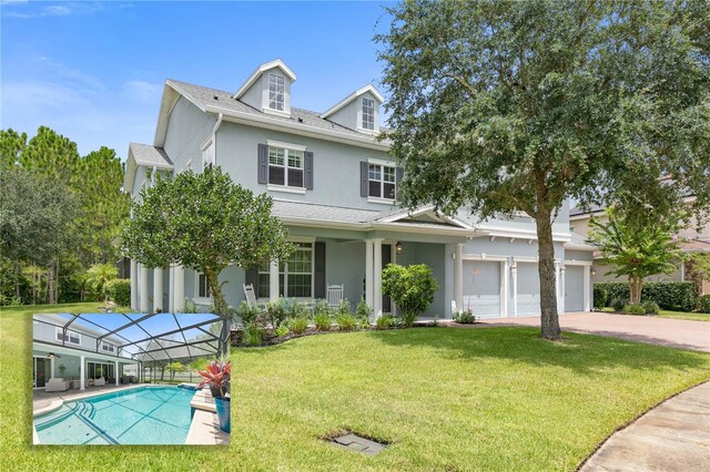 view of front of property with a garage and a front lawn