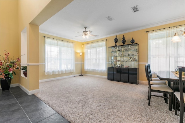 tiled home office featuring ornamental molding and ceiling fan