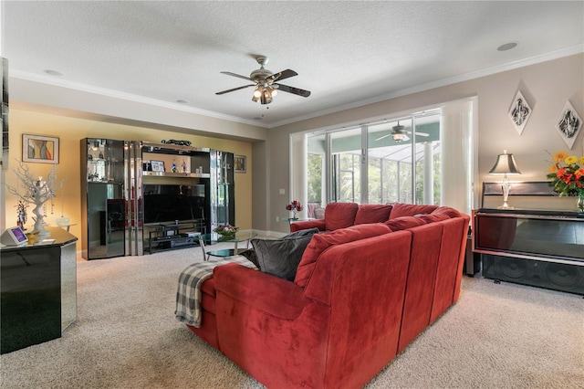 living room with carpet floors, crown molding, a textured ceiling, and ceiling fan