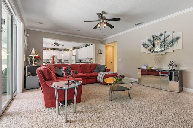 carpeted living room with a textured ceiling, crown molding, and ceiling fan