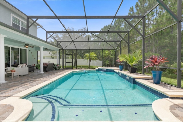 view of swimming pool featuring an outdoor hangout area, ceiling fan, a patio area, and a lanai