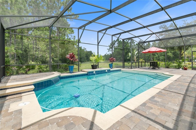 view of swimming pool featuring a lanai and a patio area