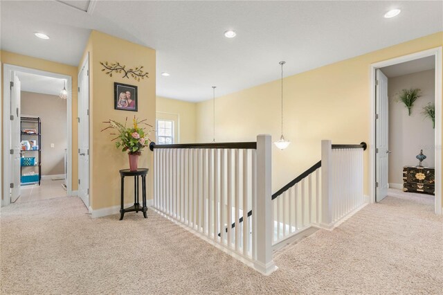 corridor with light carpet