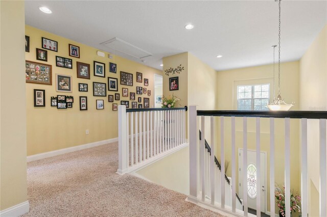 corridor with carpet flooring