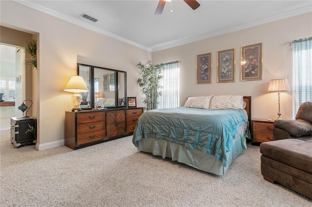 carpeted bedroom featuring ornamental molding, multiple windows, and ceiling fan