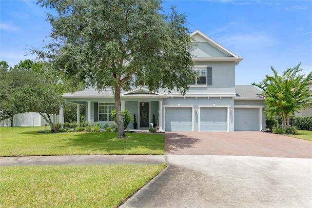 view of front facade featuring a garage and a front yard