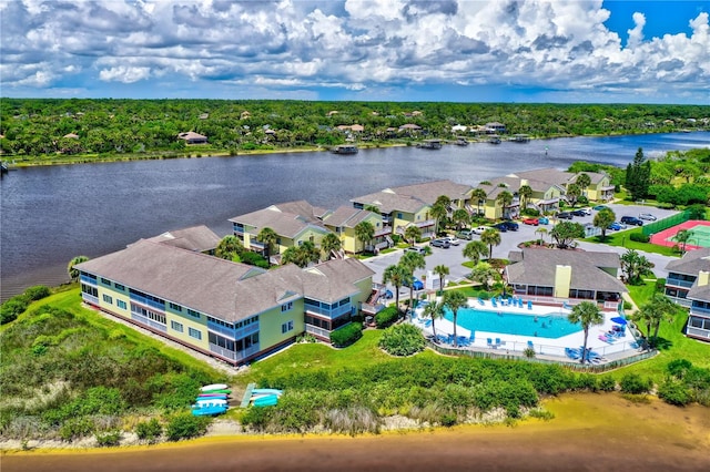 birds eye view of property with a water view