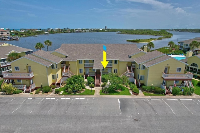 birds eye view of property featuring a water view