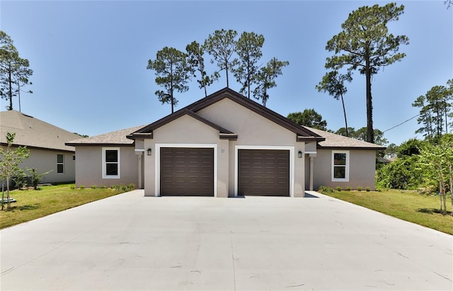 single story home featuring a garage, stucco siding, concrete driveway, and a front yard