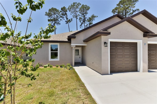 ranch-style home with an attached garage, a shingled roof, driveway, stucco siding, and a front lawn