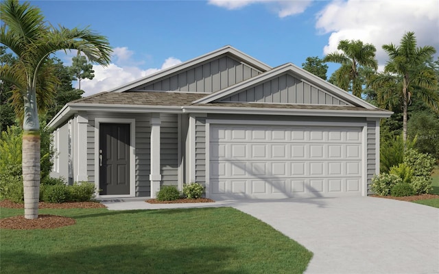 view of front of house featuring a front lawn and a garage