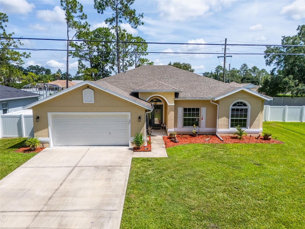 single story home with a garage and a front yard