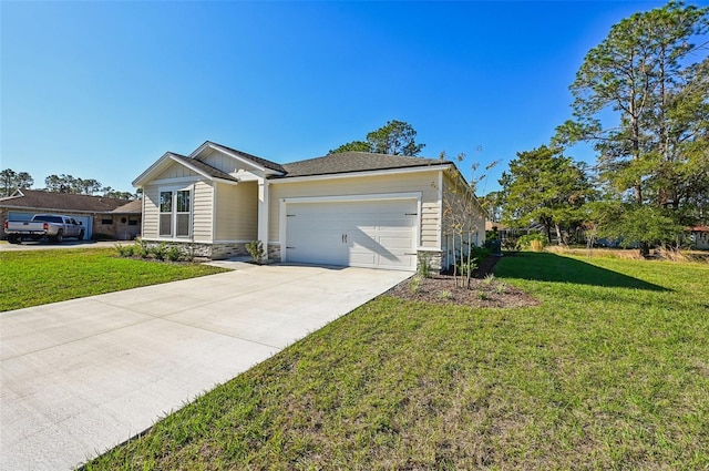 view of front of house featuring a garage and a front yard