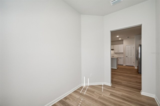 unfurnished room featuring light wood-type flooring