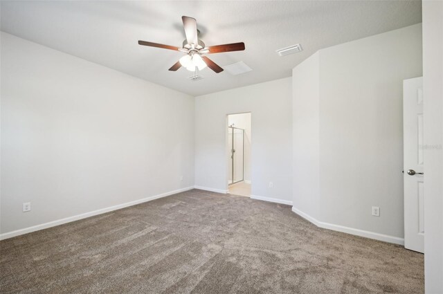 spare room featuring carpet floors and ceiling fan