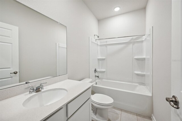 full bathroom with vanity, tile patterned floors, shower / bathtub combination, and toilet