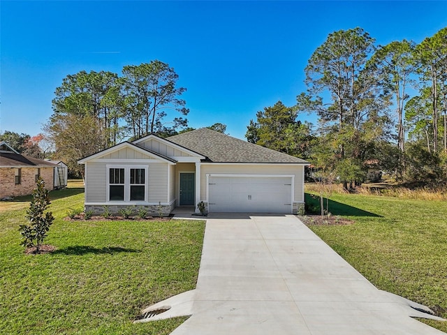 view of front facade with a garage and a front lawn