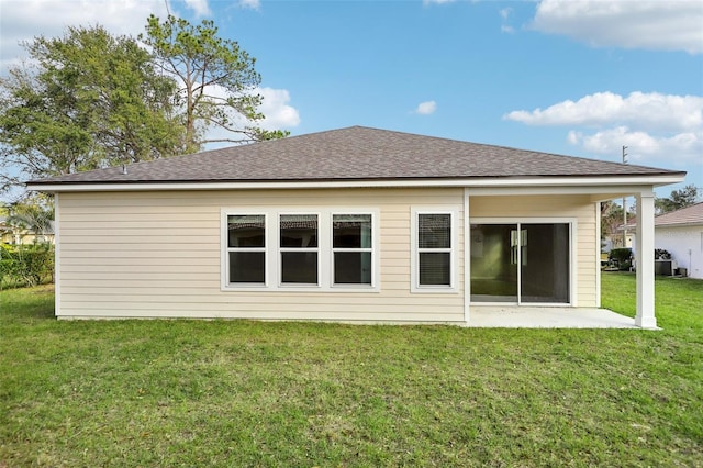 back of house featuring a yard and a patio area