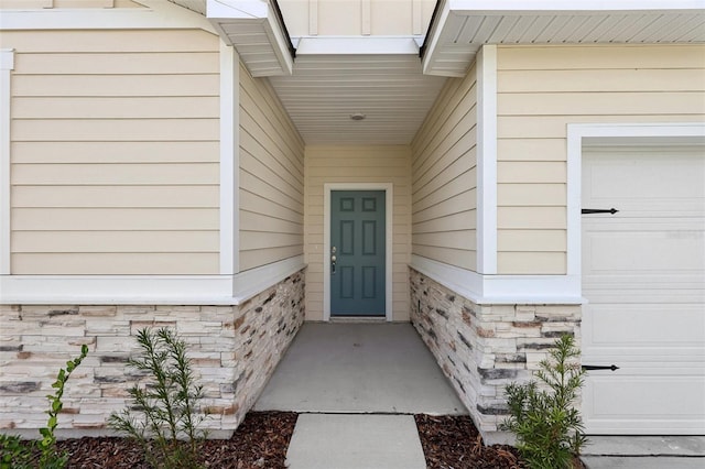 doorway to property featuring a garage